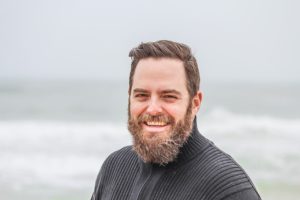 Bearded Man in Midlife Transformation on a Beach Bearded Man in Midlife Transformation on a Beach